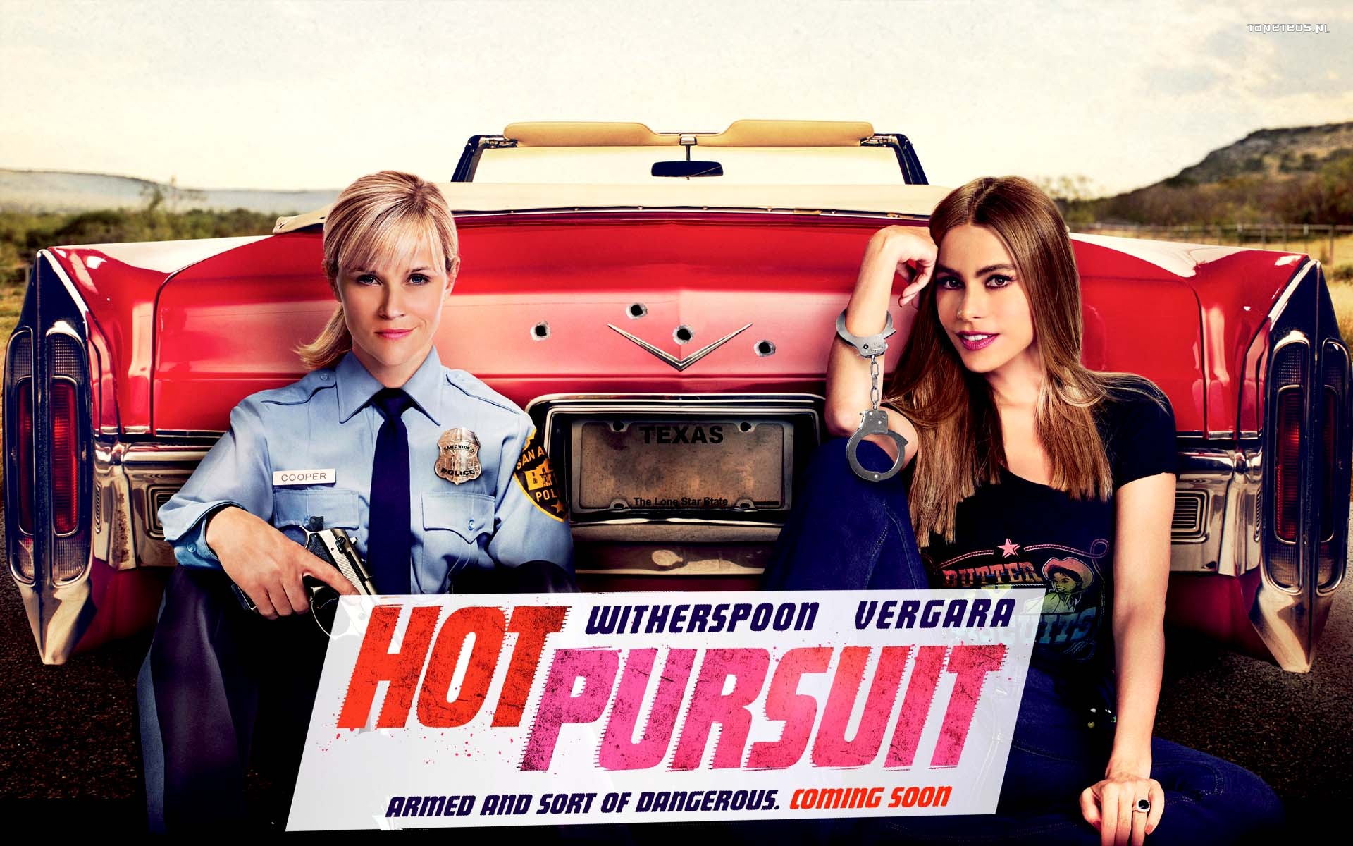 Goracy poscig (2015) Hot Pursuit 001 Reese Witherspoon jako Cooper, Sofia Vergara jako Daniella Riva, Samochod